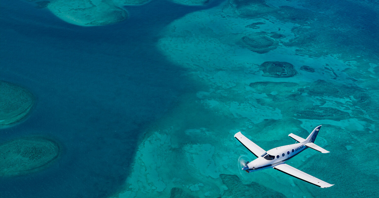 plane flying over the see
